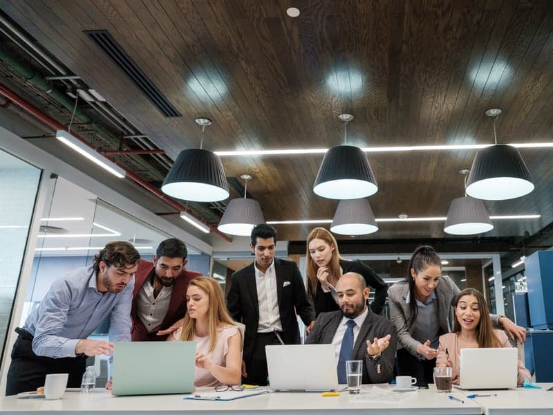 People in an office, collaborating and working together.